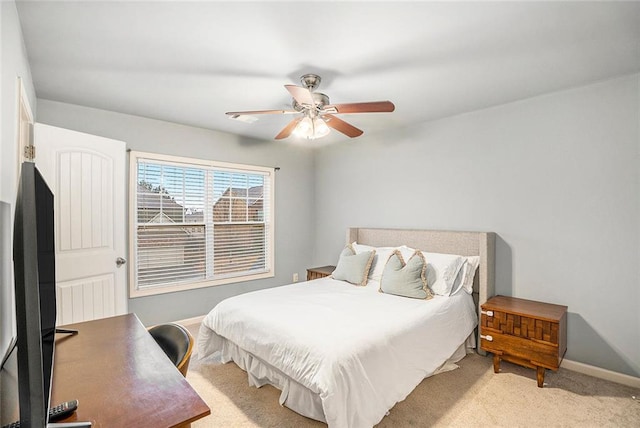 bedroom with light colored carpet and ceiling fan