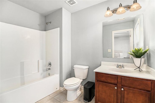 full bathroom featuring vanity, toilet, tile patterned flooring, and washtub / shower combination