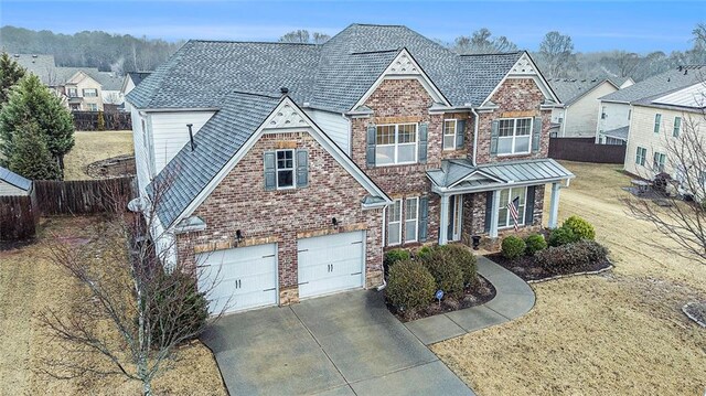 view of front of house featuring a front yard and a garage