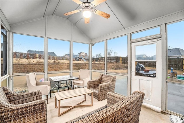 sunroom / solarium featuring ceiling fan and vaulted ceiling