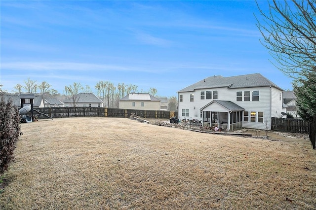 view of yard with a sunroom