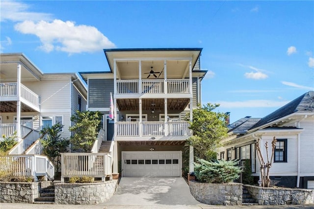 view of front facade with ceiling fan and a garage