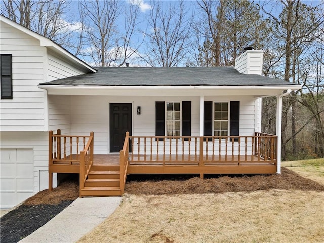 exterior space featuring a garage and covered porch