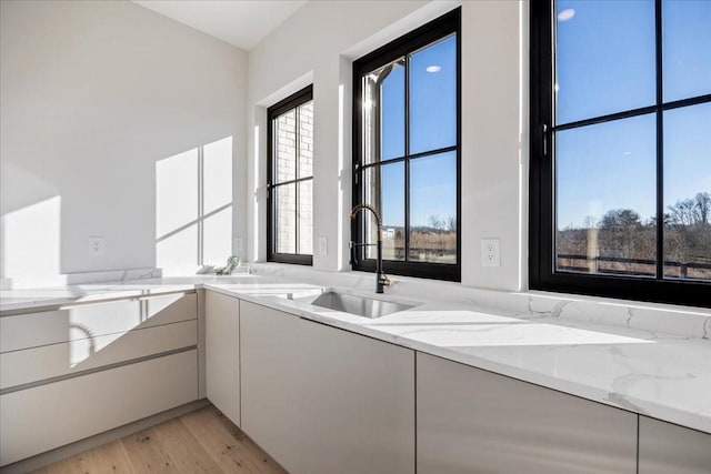 bathroom featuring sink and hardwood / wood-style floors