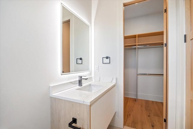 bathroom featuring vanity and wood-type flooring