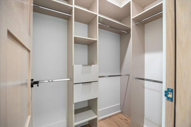 spacious closet with light wood-type flooring