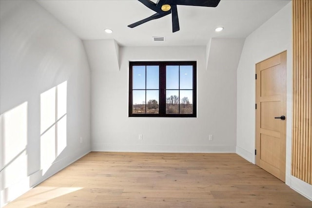 spare room with light hardwood / wood-style floors and ceiling fan