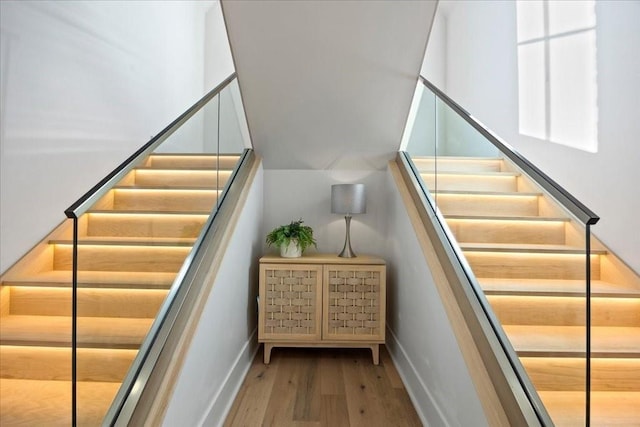 stairway featuring hardwood / wood-style floors