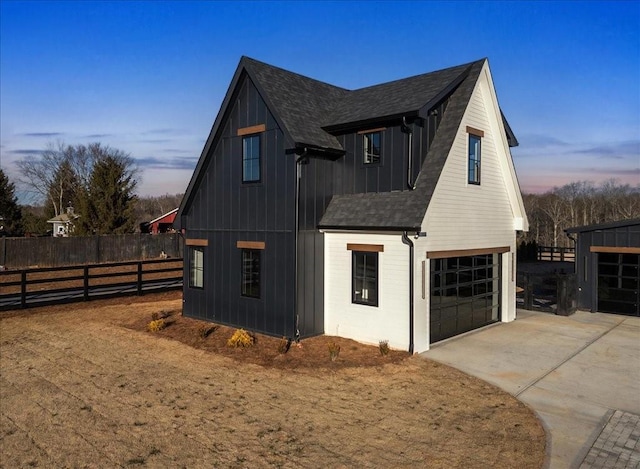 property exterior at dusk with a garage