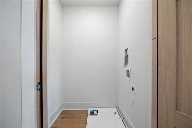 laundry area with electric dryer hookup, hardwood / wood-style floors, and hookup for a washing machine