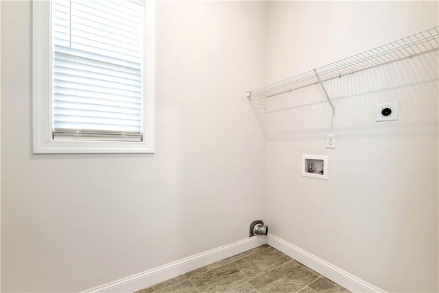 laundry area featuring hookup for an electric dryer, tile patterned floors, and washer hookup