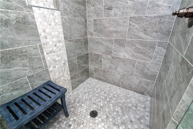 bathroom featuring tiled shower