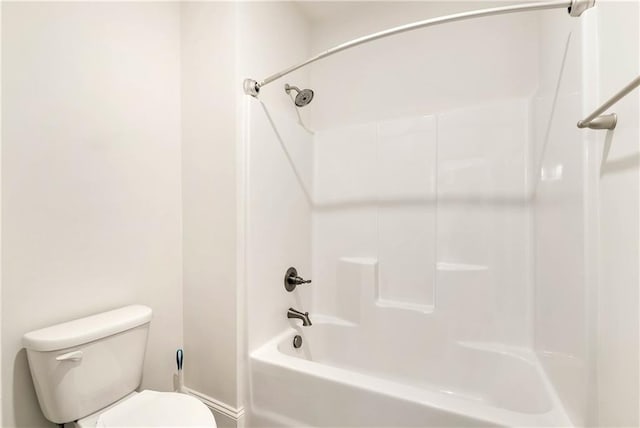 bathroom with toilet and shower / bath combination