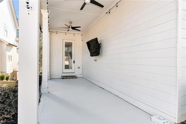 view of exterior entry featuring ceiling fan