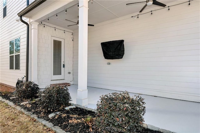 doorway to property featuring a ceiling fan