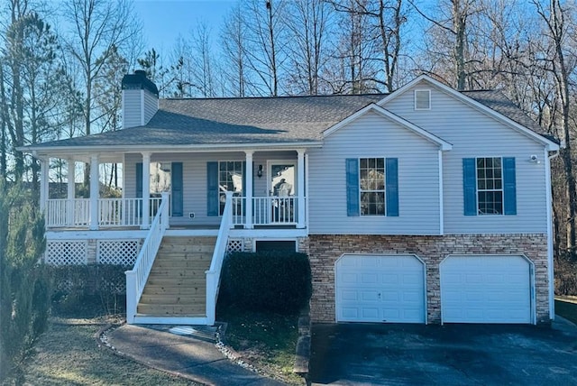 view of front of home featuring a garage and covered porch