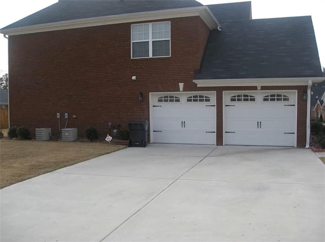 view of side of property featuring a garage