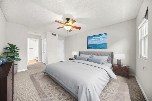 23 Chelsea Ct, Avondale Estates, GA 30002 - carpeted bedroom with visible vents, a ceiling fan, ensuite bath, baseboards, and a textured ceiling