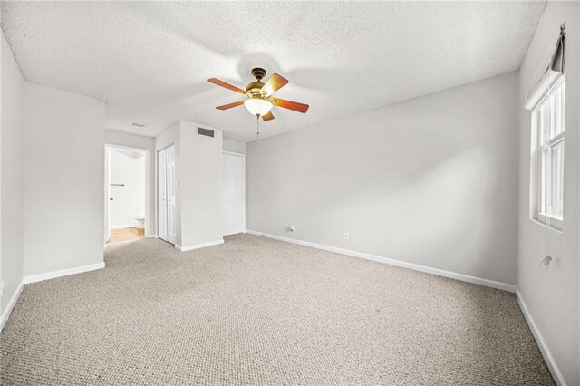 23 Chelsea Ct, Avondale Estates, GA 30002 - unfurnished bedroom with a ceiling fan, a closet, light carpet, baseboards, and visible vents