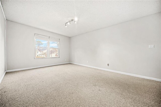 23 Chelsea Ct, Avondale Estates, GA 30002 - carpeted spare room featuring a textured ceiling and baseboards