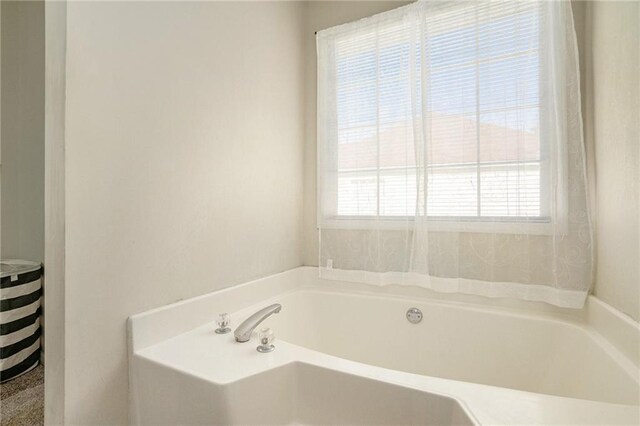 bathroom featuring a tub to relax in