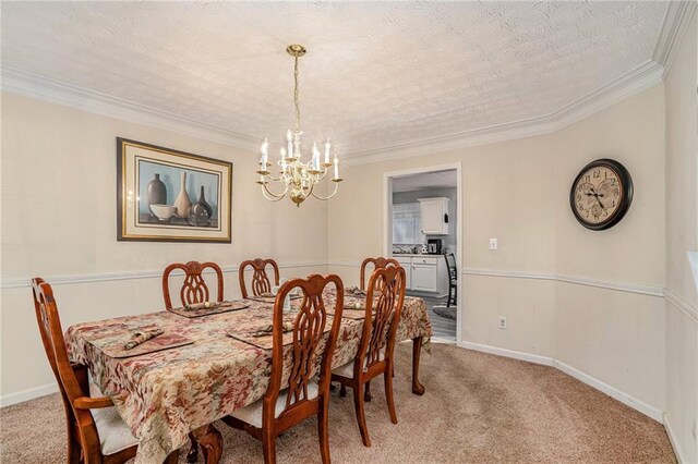 dining room with light carpet, ornamental molding, a textured ceiling, and an inviting chandelier