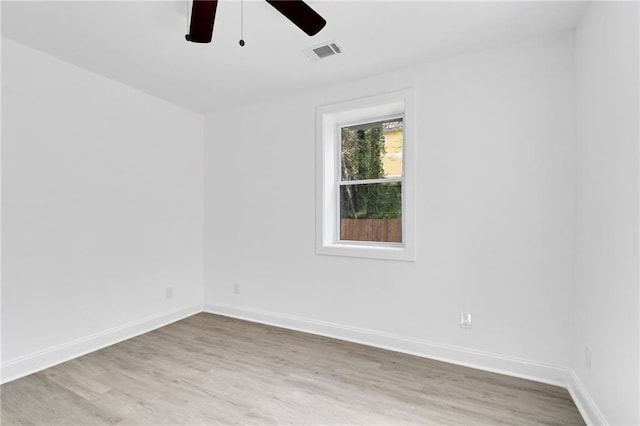 empty room featuring wood-type flooring and ceiling fan