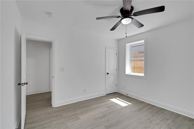 unfurnished room featuring ceiling fan and light hardwood / wood-style flooring