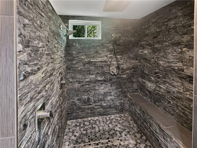 bathroom featuring a tile shower