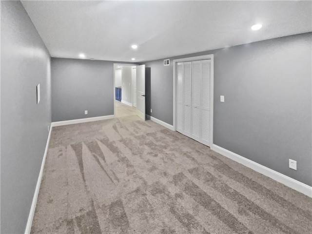 finished basement featuring recessed lighting, carpet floors, and baseboards