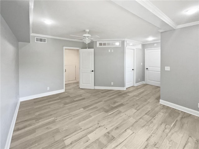 empty room featuring ceiling fan, baseboards, light wood-style floors, and visible vents