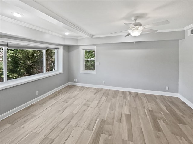 spare room with baseboards, wood finished floors, ceiling fan, and ornamental molding