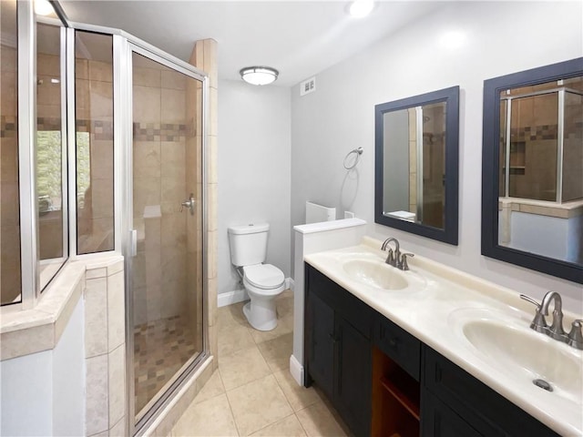 full bathroom featuring tile patterned floors, a sink, and a stall shower