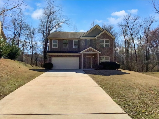 view of front of house with concrete driveway, an attached garage, brick siding, and a front lawn