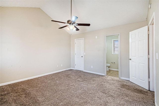 unfurnished bedroom with ceiling fan, ensuite bath, lofted ceiling, and light carpet