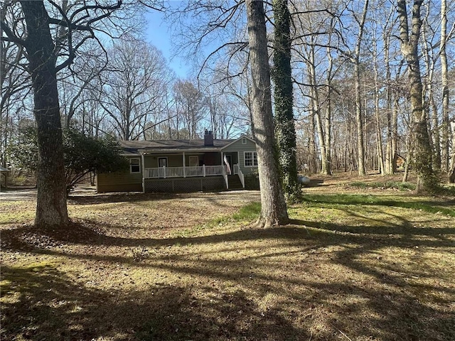 view of yard with covered porch