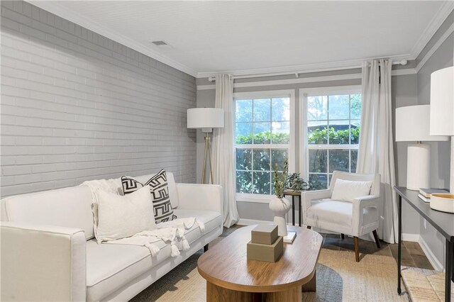2070 Drew Valley Rd NE, Brookhaven, GA 30319 - living room featuring brick wall and ornamental molding