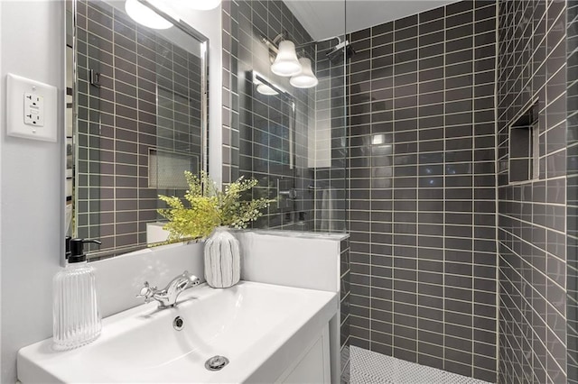 2070 Drew Valley Rd NE, Brookhaven, GA 30319 - bathroom featuring tiled shower, vanity, and tile walls