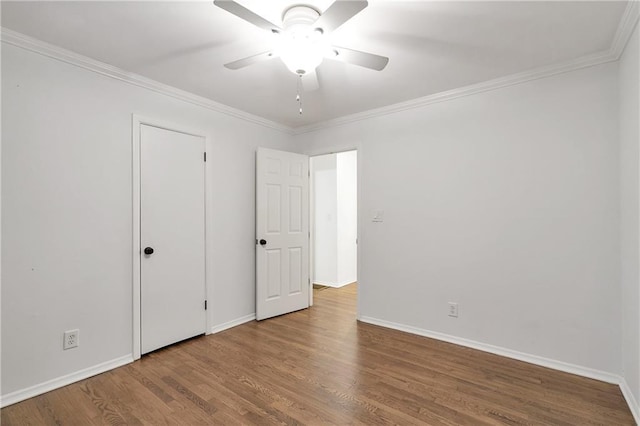 2070 Drew Valley Rd NE, Brookhaven, GA 30319 - unfurnished bedroom with wood finished floors, crown molding, and ceiling fan