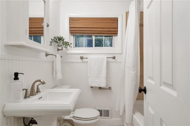 2070 Drew Valley Rd NE, Brookhaven, GA 30319 - full bathroom featuring a wainscoted wall and shower / tub combo