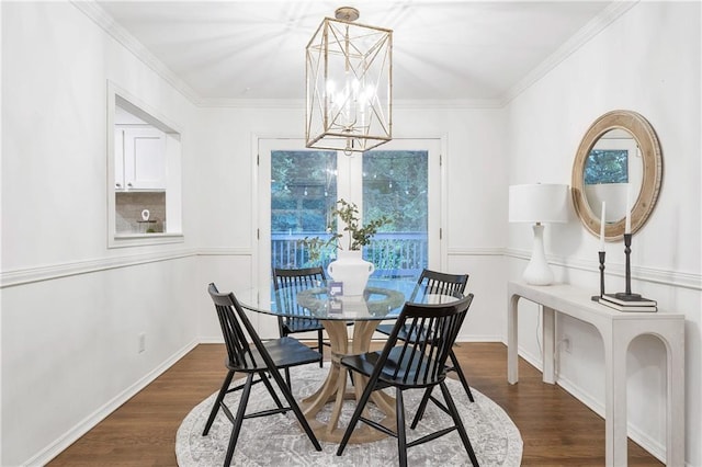 2070 Drew Valley Rd NE, Brookhaven, GA 30319 - dining space featuring a chandelier, dark wood-type flooring, and crown molding
