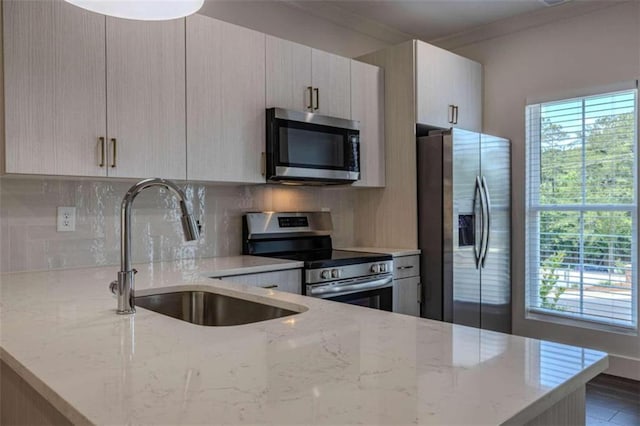 117 Chateau Dr Unit 117, Rome, GA 30161 - kitchen with light stone counters, visible vents, a sink, decorative backsplash, and appliances with stainless steel finishes