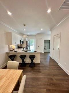 117 Chateau Dr Unit 117, Rome, GA 30161 - living area featuring baseboards, wood finished floors, recessed lighting, and crown molding