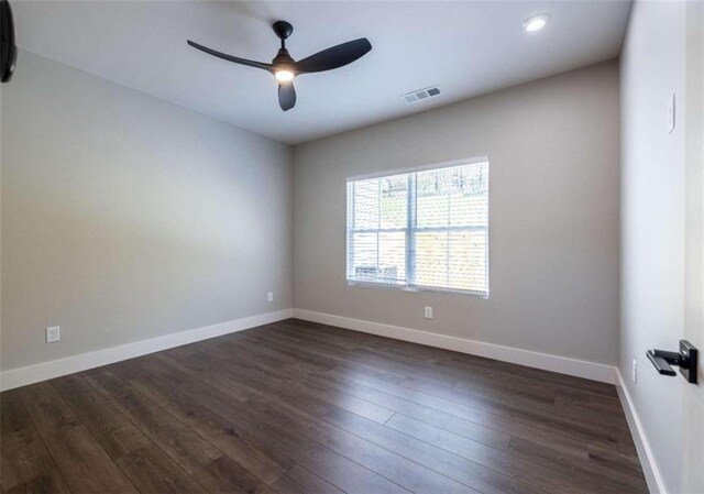 living area featuring vaulted ceiling and dark hardwood / wood-style floors