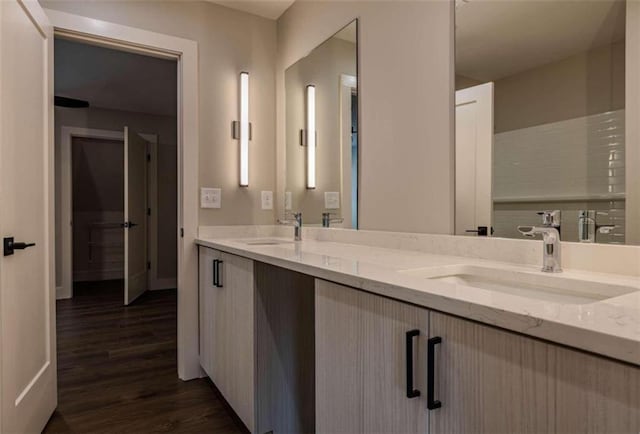 117 Chateau Dr Unit 117, Rome, GA 30161 - bathroom with washtub / shower combination, wood finished floors, baseboards, and vanity