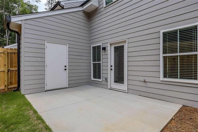 117 Chateau Dr Unit 117, Rome, GA 30161 - view of exterior entry featuring a patio area and fence