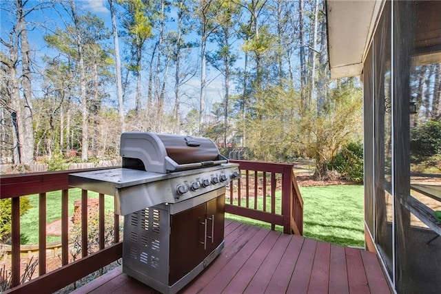 wooden terrace with a yard