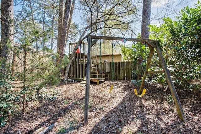 view of yard with a playground and fence