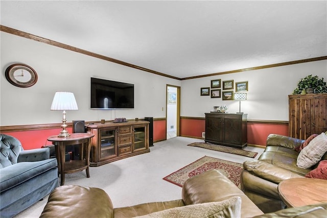 living room featuring carpet, ornamental molding, and wainscoting