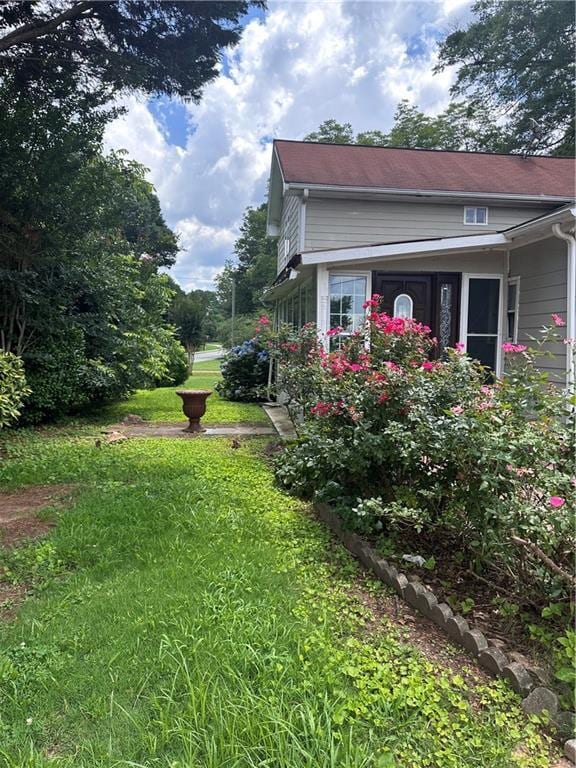 702 Moon Rd, Lawrenceville, GA 30046 - view of home's exterior featuring a lawn